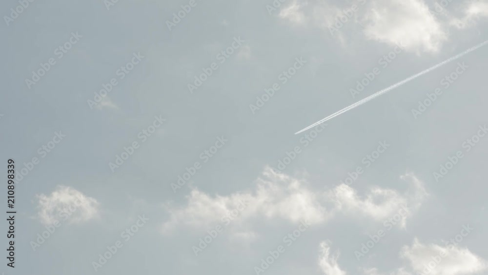 View of Airplane jet, aircraft pollution on sky, white trace vapour by day. View of Airplane jet, aircraft pollution on sky, white trace vapour by day.