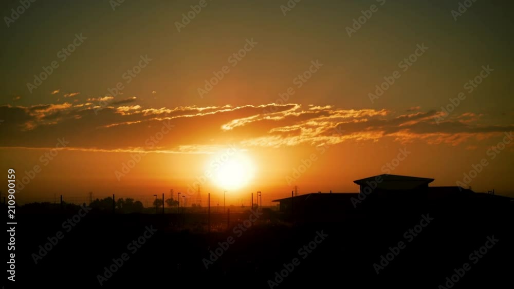 Brilliant Sunrise Behind Clouds and Fence Stylized Brilliant Sunrise Behind Clouds and Fence Stylized