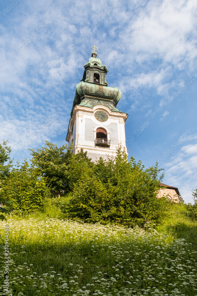 Old Castle clock tower in Banska Stiavnica, central Slovakia with blue sky and copy space