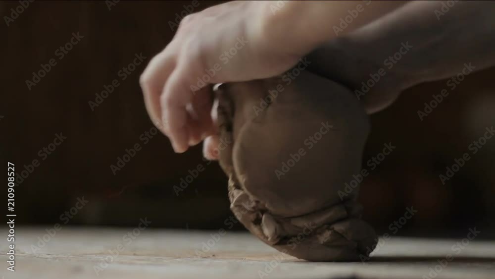 preparing to creative. Sculptor hands knead clay for pottery or mold model preparing to creative. Sculptor hands knead clay for pottery or mold model