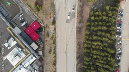 Drone footage of a road with some cars on it. photo