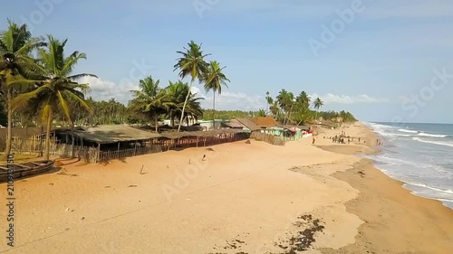 Travelling to men pushing a large pirogue