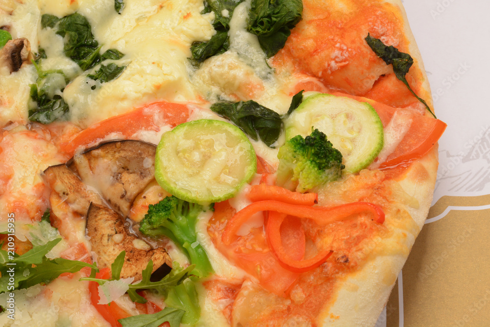 Rustic deep dish pizza with mozzarella cheese, salami, ham, black olives, mushrooms, spices and fresh basil.