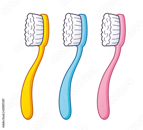 Yellow, blue and pink toothbrush isolated.