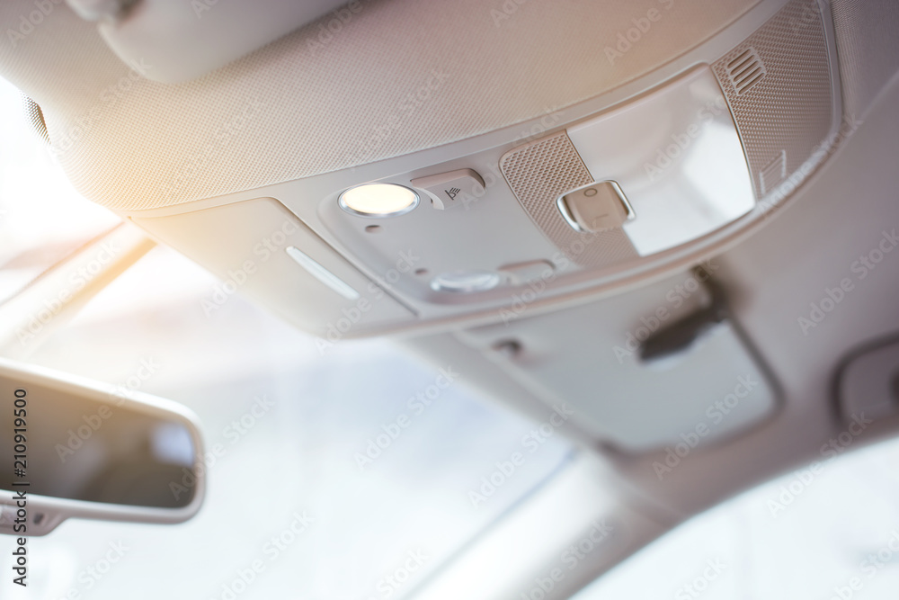 Close up of car interior modern overhead light. Close up of car interior modern overhead light.