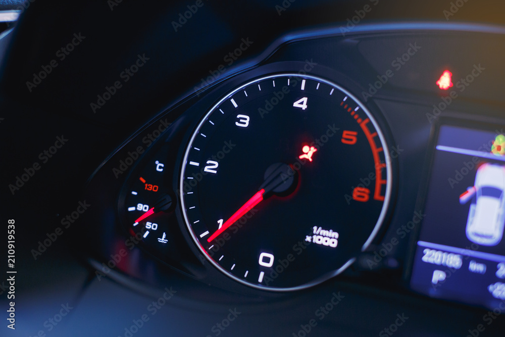 Sport car speedometer and fuel indicator. Close up view