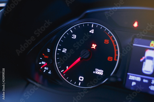 Sport car speedometer and fuel indicator. Close up view