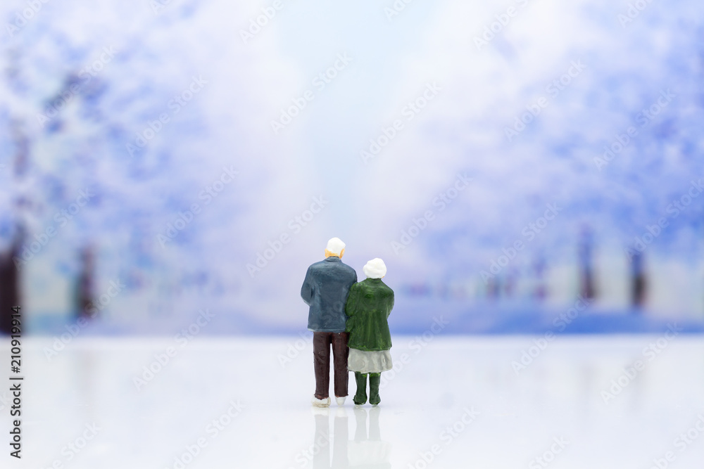 Miniature people: Couple show each other to show love, travel together . Image use for Valentine's day concept.