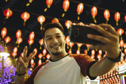 Man taking selfie at lantern festival