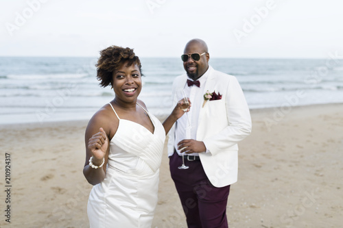 Newlyweds enjoying their wedding reception on the beach