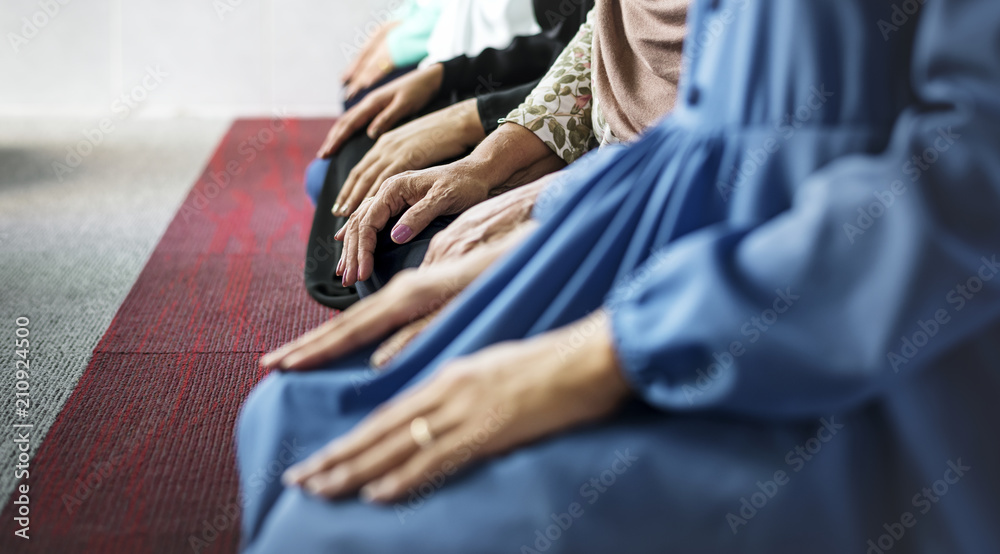 Muslim praying in Tashahhud posture - obrazy, fototapety, plakaty 