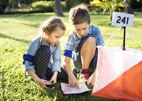 Kids finding direction on a map photo