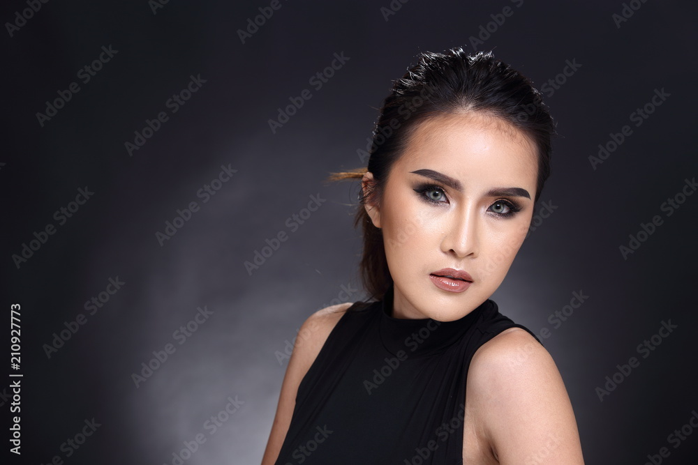 Fototapeta premium Asian Long straight black hair tan skin woman in Black dress