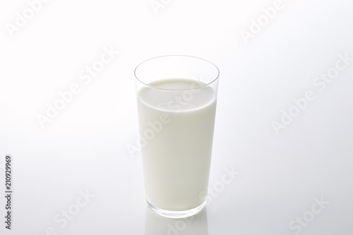 fresh milk in the glass on white background