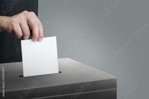Billede på lærred Election vote, hand holding ballot paper for election vote concept at place election background
