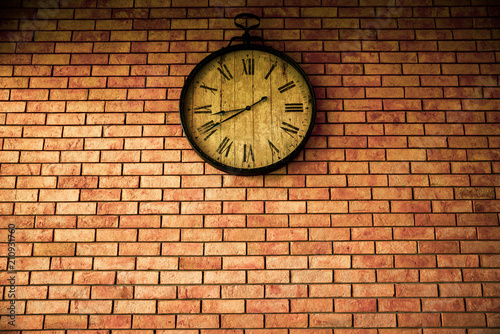 Wall Clock vintage retro styles hanging on the brick wall.