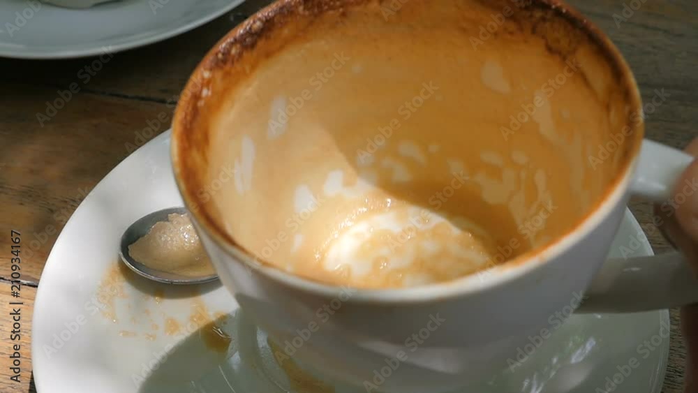 The empty coffee cup. Close up. Front view. Slow motion. The empty coffee cup. Close up. Front view. Slow motion.