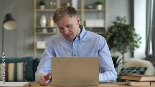 Angry Businessman Reacting to Loss at Work photo