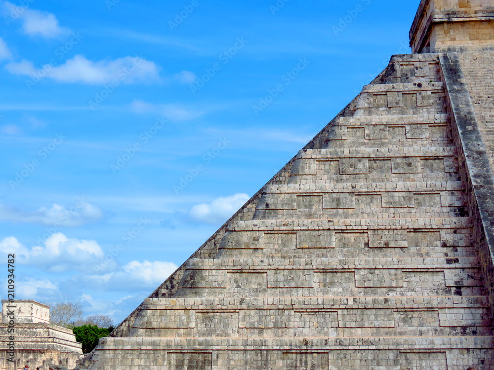 People visiting the ancient buildings of maya culture in chichen itza, quitana roo, mexico, like the pyramid, jaguar temple, planetary, etc.