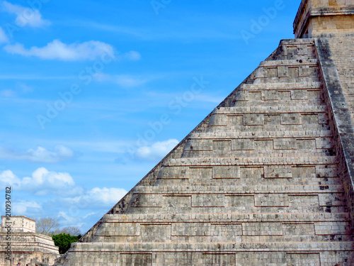 People visiting the ancient buildings of maya culture in chichen itza, quitana roo, mexico, like the pyramid, jaguar temple, planetary, etc.