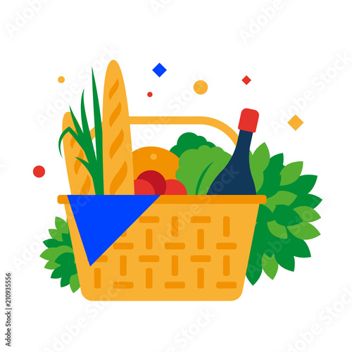 Picnic basket with baguette, fruit and drinks.