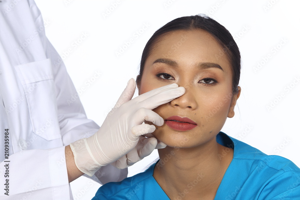Doctor Nurse check face nose structure before plastic surgery Doctor Nurse check face nose structure before plastic surgery