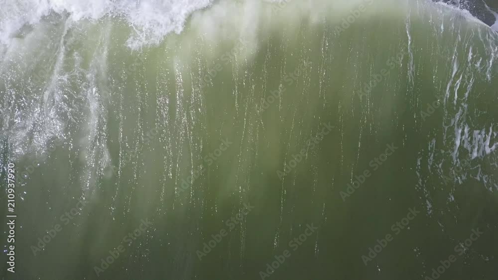 Large wave crashing in the emerald green waters of East Hampton Main Beach Large wave crashing in the emerald green waters of East Hampton Main Beach