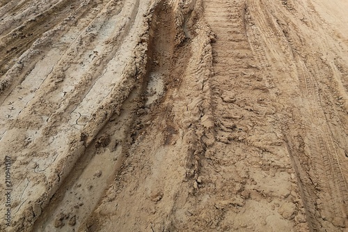 tire track of many vehicle on soil mud road in countryside