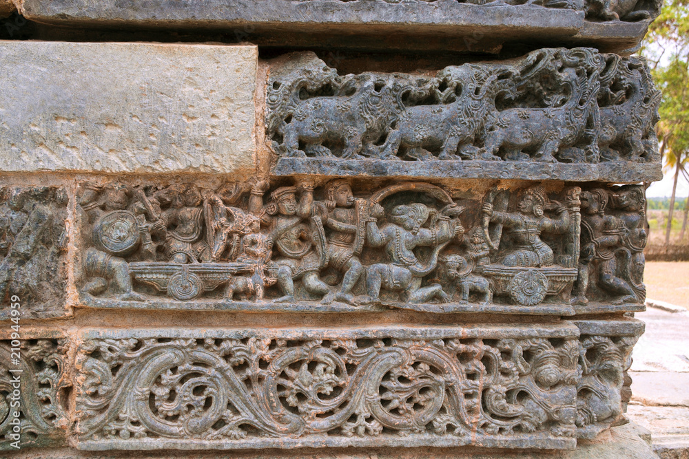Friezes at the base of temple. Kedareshwara temple, Halebidu, Karnataka, India