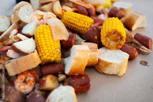 Freshly Cooked Southern Boil with Shrimp, Corn, Sausage, Potato, Onion, and Bread photo