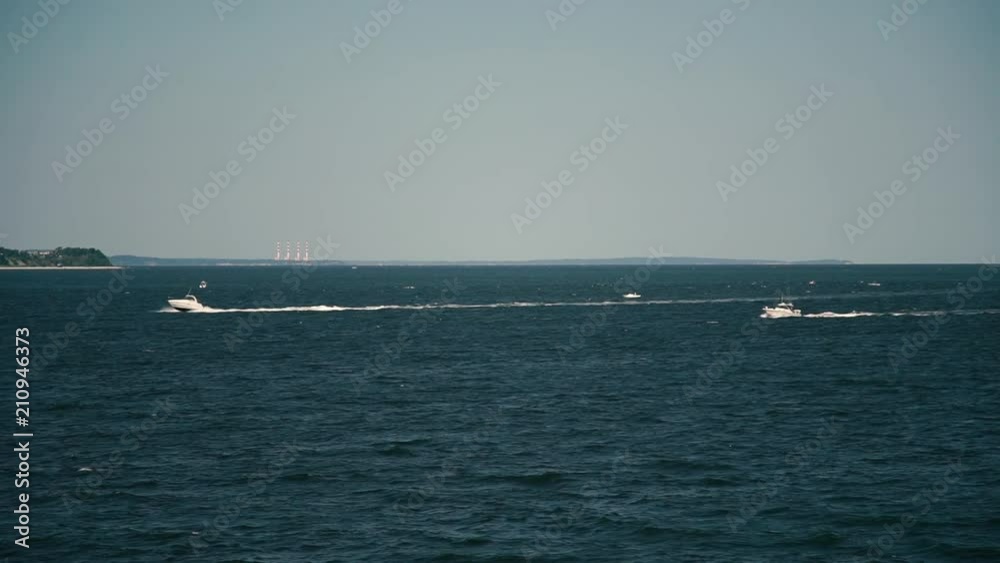 Fancy Yachts seem to race across the waters in Long Island Sound Fancy Yachts seem to race across the waters in Long Island Sound
