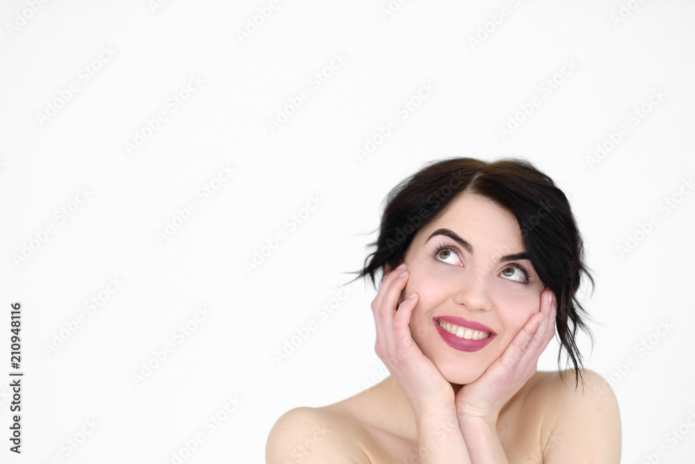 emotion face. happy smiling joyful jolly woman holding head in hands. young beautiful brunette girl portrait on white background. emotion face. happy smiling joyful jolly woman holding head in hands. young beautiful brunette girl portrait on white background.