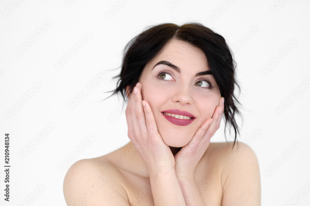emotion face. happy smiling joyful jolly woman holding head in hands. young beautiful brunette girl portrait on white background. emotion face. happy smiling joyful jolly woman holding head in hands. young beautiful brunette girl portrait on white background.