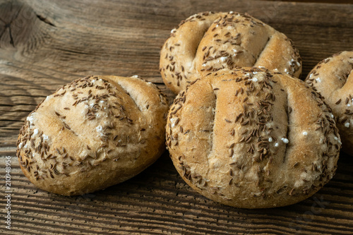 Bread rolls sprinkled with salt and caraway. Bakery assortment of bread.
