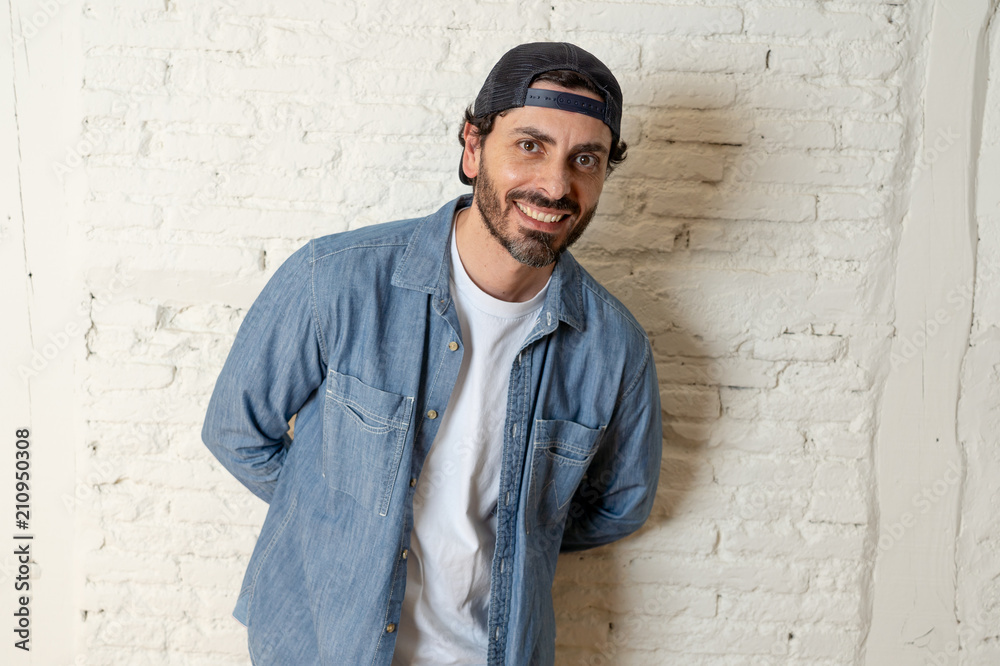 young good looking latin man blogger talking to camera on white background young good looking latin man blogger talking to camera on white background