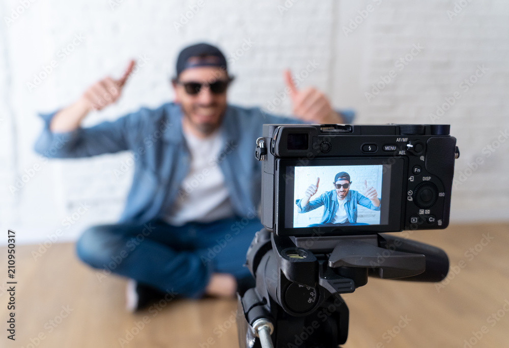 young happy blogger close up on camera screen young happy blogger close up on camera screen