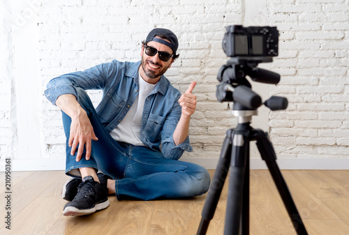attractive man blogger talking to the camera in internet blog concept. © SB Arts Media
