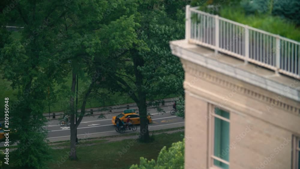 Looking down into traffic inside Central Park from an NYC highrise Looking down into traffic inside Central Park from an NYC highrise