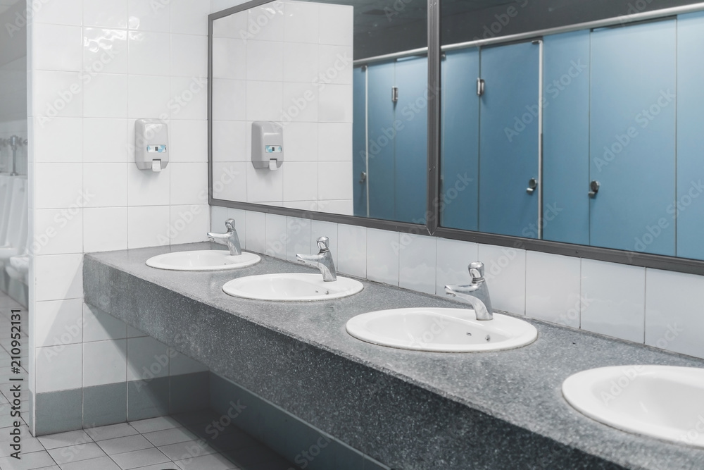 Public toilet and Bathroom interior with wash basin and toilet room. Stock Photo | Adobe Stock