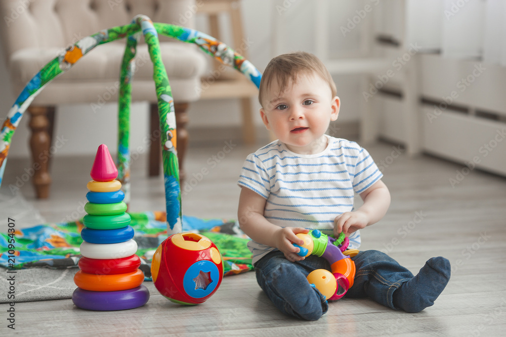 Obraz premium Cute little child playing indoors. Pretty infant baby boy