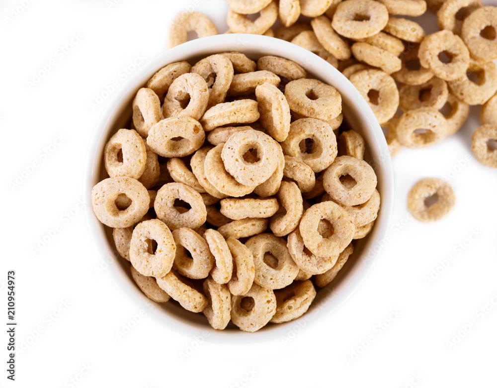 healthy cereal rings on white background. Good morning. A healthy, healthy breakfast. Dry muesli. healthy cereal rings on white background. Good morning. A healthy, healthy breakfast. Dry muesli.
