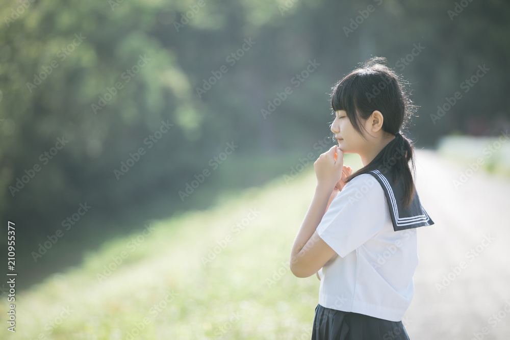 Portrait of asian japanese school girl costume looking at park outdoor film vintage style Portrait of asian japanese school girl costume looking at park outdoor film vintage style