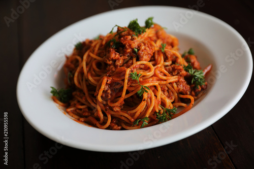 Spaghetti bolognese on wood background , italian food