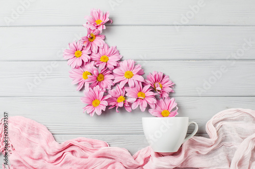 gentle still life: gerbera flowers and white cup photo