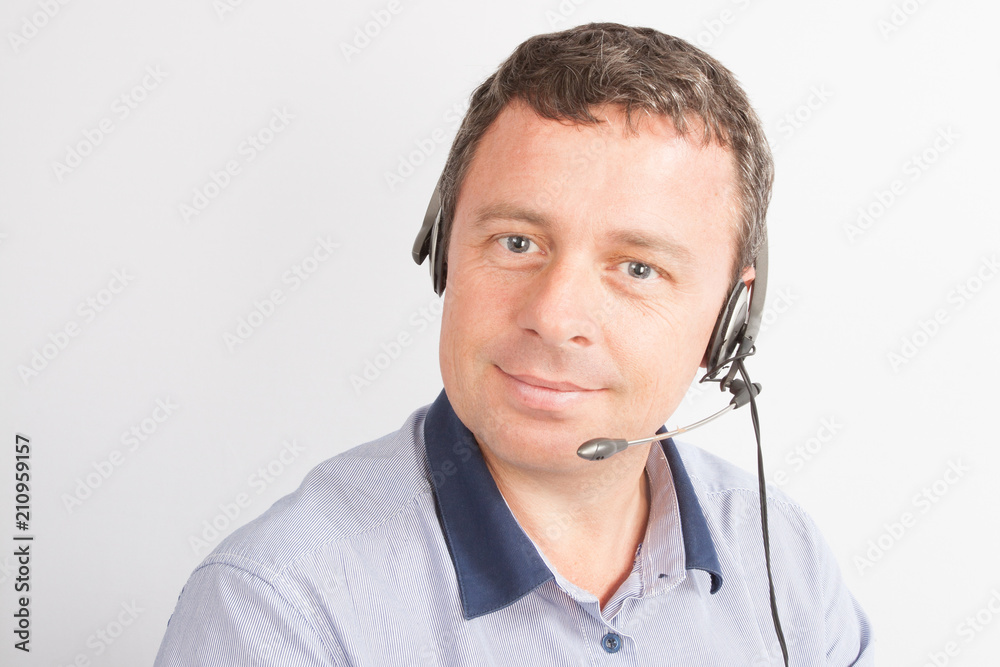 man Customer service representative wearing headset at the office man Customer service representative wearing headset at the office