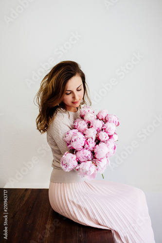 Bouquet of peonies in hands