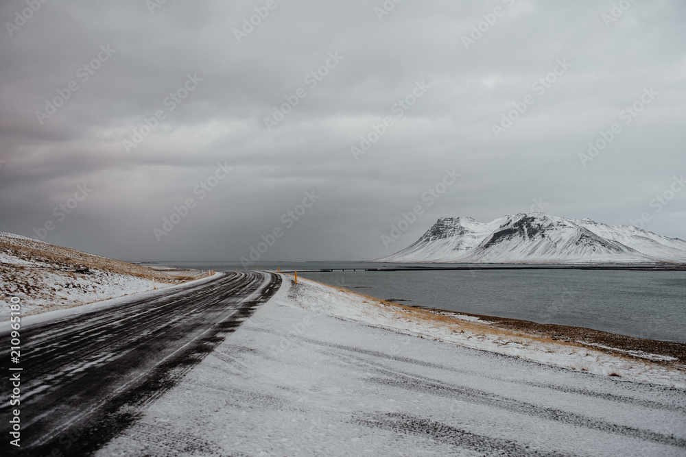 A road through a snowy landscape in Iceland A road through a snowy landscape in Iceland
