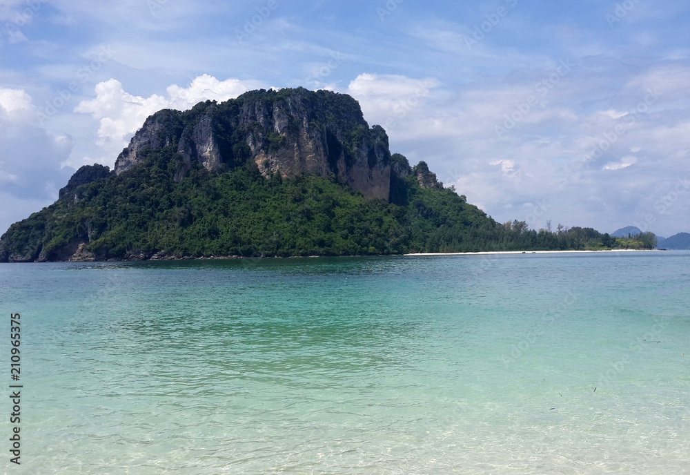 Beautiful seascape of famous scenery Thailand sea with island, crystal clear green turquoise water and tropical white sand beach at Krabi, Andaman sea, Thailand. Summer vacation tourism beach concept.