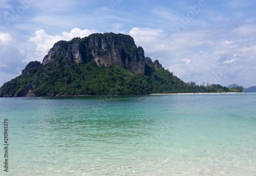 Beautiful seascape of famous scenery Thailand sea with island, crystal clear green turquoise water and tropical white sand beach at Krabi, Andaman sea, Thailand. Summer vacation tourism beach concept. © LilacN