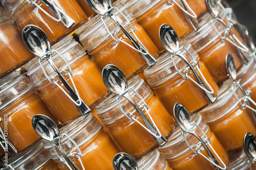 Stacked small jars of salted butter caramel
